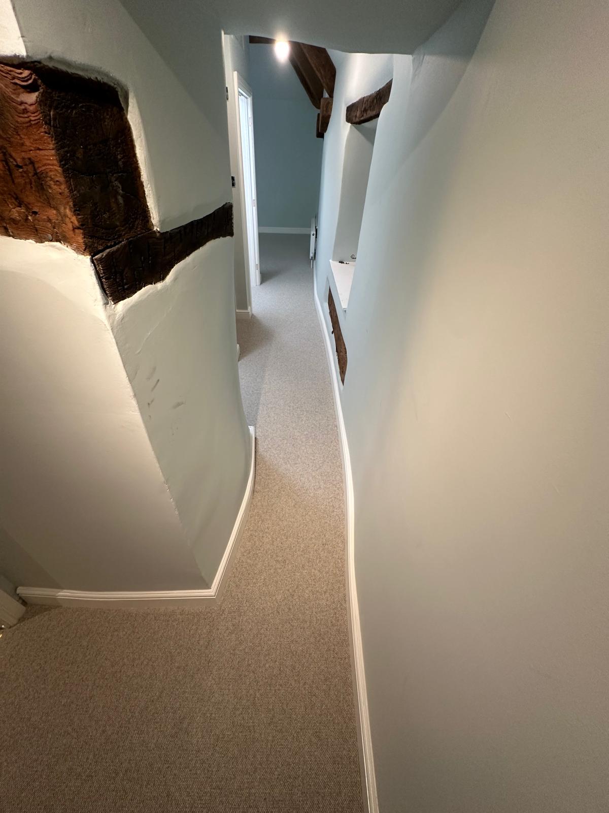 Light grey loop pile carpet fitted in a traditional cottage hallway in Marlborough